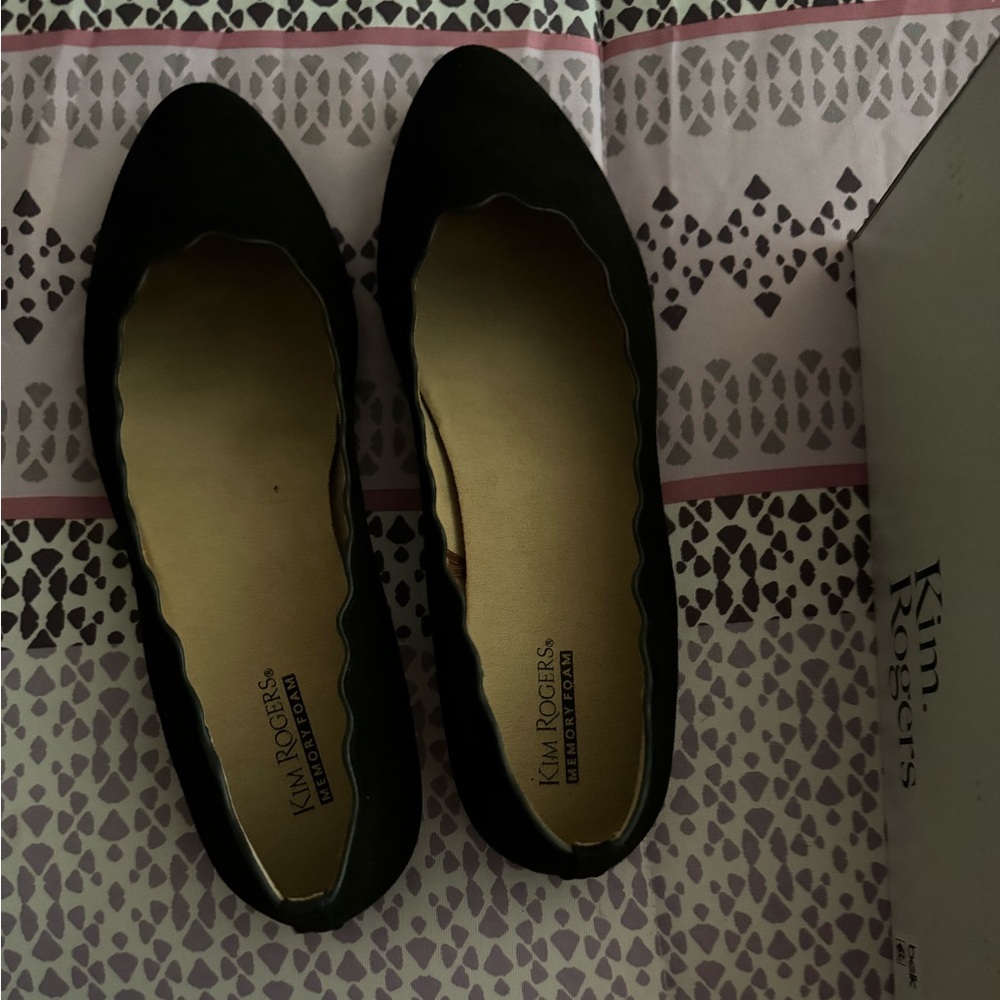 Never worn.  A black flat. Can be worn with slacks, jeans or skirt.